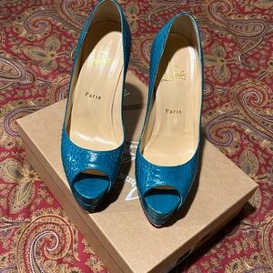 Louboutin water, snake shoes